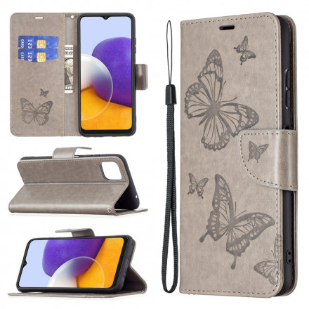 Hülle Samsung Galaxy A22 5G Die fliegenden Schmetterlinge mit Lanyard