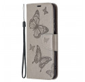 Custodia Xiaomi Redmi Note 10/10S/Poco M5s con cinturino con farfalle stampate